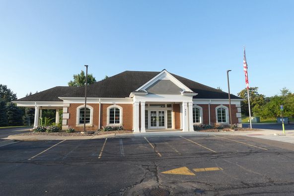 Former Bank Branch: 9402 E Highland Rd, Howell, MI 48843